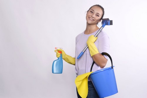 Technician using equipment for commercial carpet cleaning on office flooring